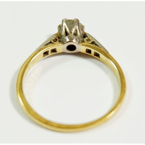 254 - A early 20th century 18ct gold and platinum set solitaire diamond ring on diamond chip shoulders, si... 