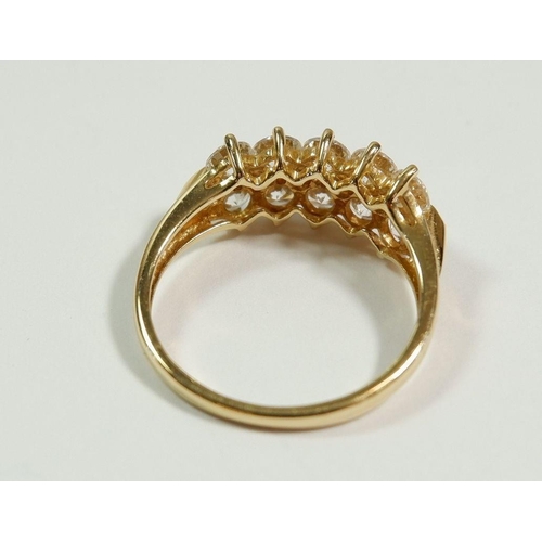 256 - A 14 carat gold dress ring set two rows of white stones, size N to O