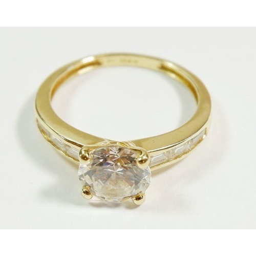 261 - A 14 carat gold dress ring set central white stone on baguette cut shoulders, size O to P