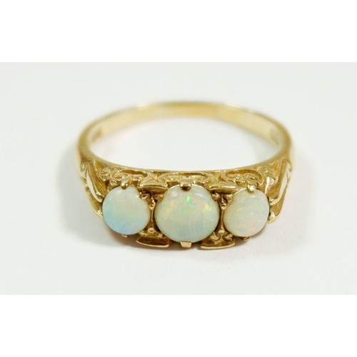 263 - A 9 carat gold ring set three opals, size Q