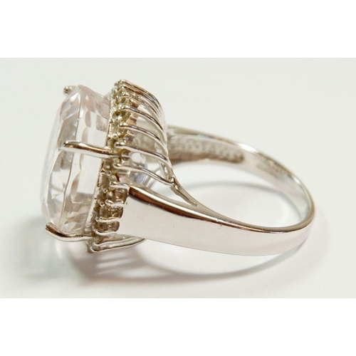 279 - An 18 carat white gold ring set large danburite within white stone surround, size N, 10.7g