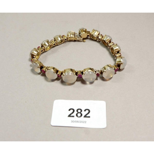 282 - A silver gilt moonstone and ruby link bracelet, 17.5cm