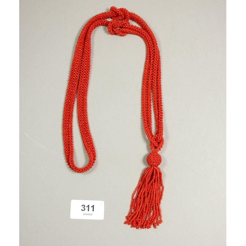 311 - An Art Deco style coral tassel necklace, 49cm