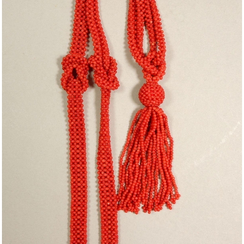 311 - An Art Deco style coral tassel necklace, 49cm