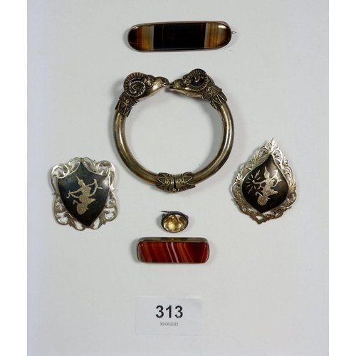 313 - A silver rams head hinged bangle, two agate brooches, two silver Siam brooches and a citrine brooch