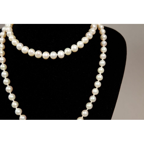 318 - Two strings of pearls with a gold clasp, string a/f