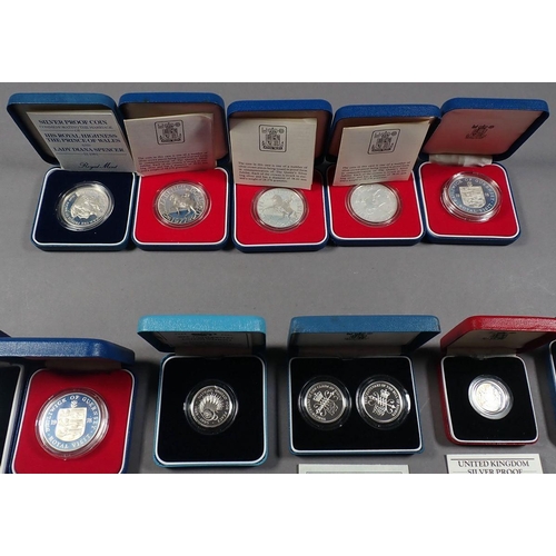 423 - A quantity of Royal Mint issues mainly silver content coinage in presentation cases with certificate... 