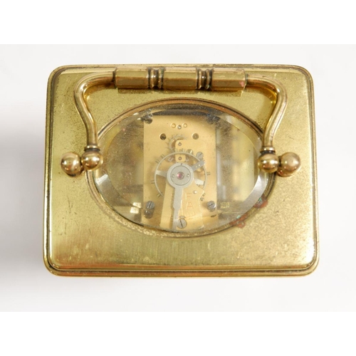 595 - A brass carriage clock 11cm tall