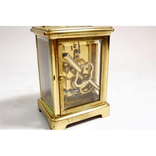 595 - A brass carriage clock 11cm tall