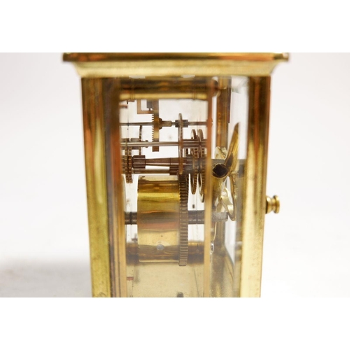 595 - A brass carriage clock 11cm tall