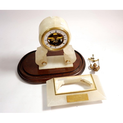 597 - A Victorian alabaster mantel clock with cherub pendulum a/f, with presentation to Reverend Dash at N... 