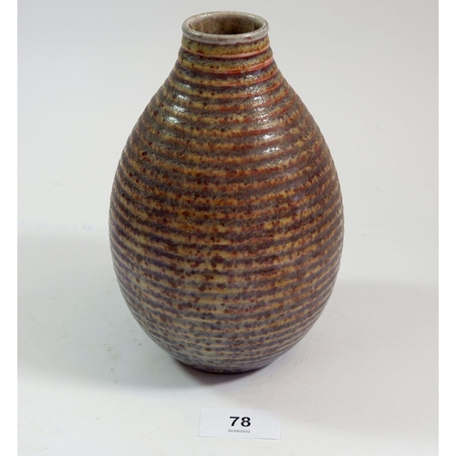 78 - A Royal Doulton Art Pottery vase, the ribbed body with purple to red speckled lustre glaze, unusual ... 