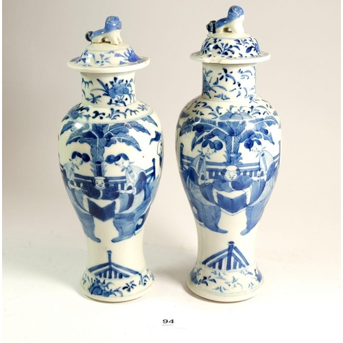 94 - A pair of Chinese baluster blue and white vases painted woman in a garden, 27.5cm