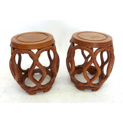 992 - A Chinese pair of circular occasional tables with carved interlaced rope design, 44cm tall