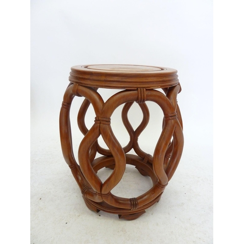 992 - A Chinese pair of circular occasional tables with carved interlaced rope design, 44cm tall