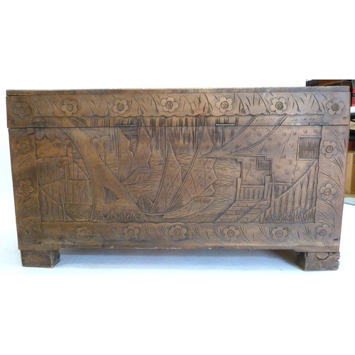 993 - A carved Chinese camphorwood chest, 61 x 111 x 55 cm