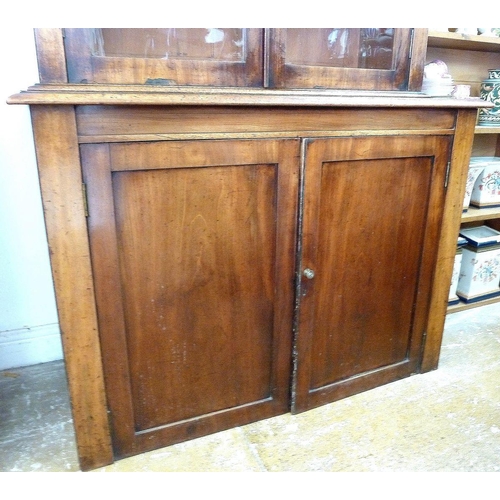 998 - A Victorian mahogany bookcase with pair of glazed doors over pair of panelled doors, 112cm wide (lac... 