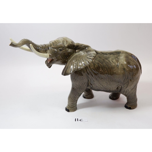 11C - A large Beswick elephant, tusk a/f, 25cm tall