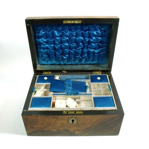 1002 - A Victorian walnut work box with inner tray