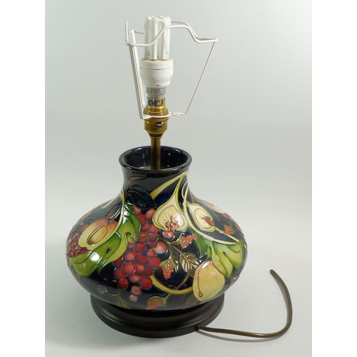 103 - A large Moorcroft table lamp in the Queens Choice pattern, 22cm tall