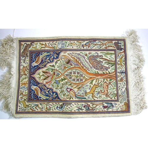 1070 - A miniature silk Persian style rug, 55 x 38cm