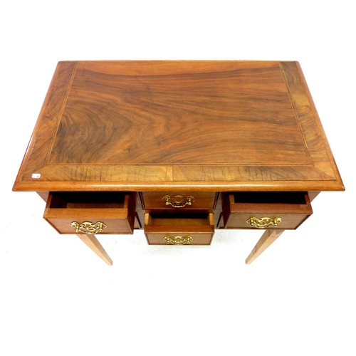 1085 - A small desk with six small drawers, 66cm wide