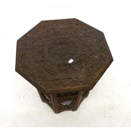 1088 - A small Indian carved hardwood small octagonal occasional table, 33cm tall