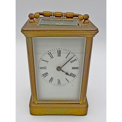 1099 - A brass carriage clock with key, 11.5cm