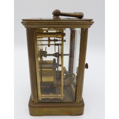 1099 - A brass carriage clock with key, 11.5cm