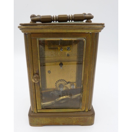 1099 - A brass carriage clock with key, 11.5cm