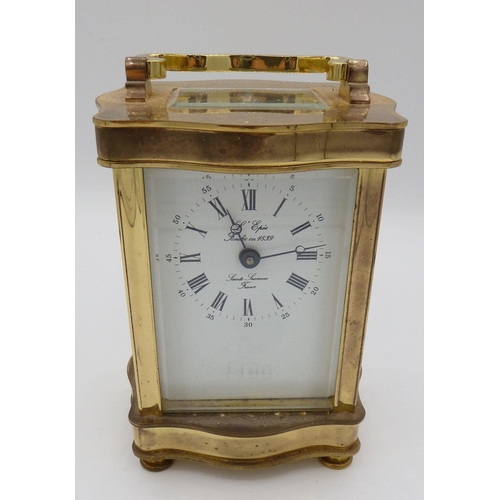 1100 - A French brass cased carriage clock, 12cm tall