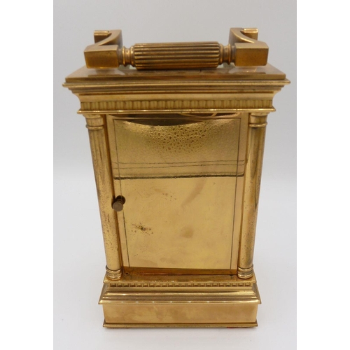 1101 - A Victorian brass carriage clock with four columns and repeater striking movement, 16cm to top of ca... 