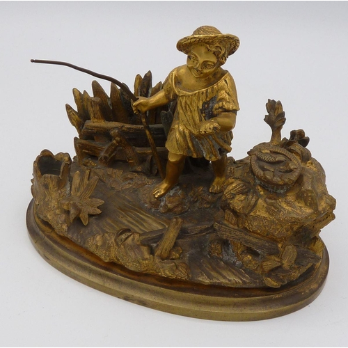 1104 - A 19th century gilt bronze inkwell in the form of a child fishing, 13.5 cm wide