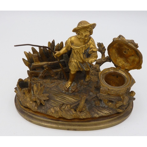 1104 - A 19th century gilt bronze inkwell in the form of a child fishing, 13.5 cm wide