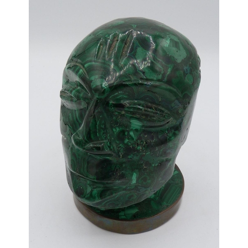 1105 - A carved malachite head of a man on brass plinth, 11cm tall