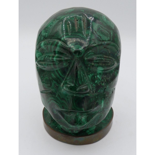 1105 - A carved malachite head of a man on brass plinth, 11cm tall