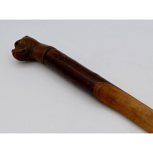 1110 - A Victorian letter opener or small paper folder with carved bull dogs head handle, 29cm long