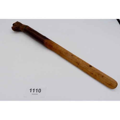 1110 - A Victorian letter opener or small paper folder with carved bull dogs head handle, 29cm long