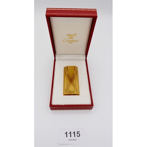 1115 - A gold plated Cartier cigarette lighter, boxed