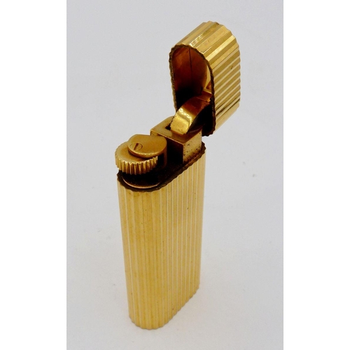 1115 - A gold plated Cartier cigarette lighter, boxed