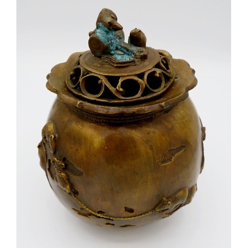 1116 - A Japanese brass incense burner with cast rat finial to lid and decoration to body raised on three s... 