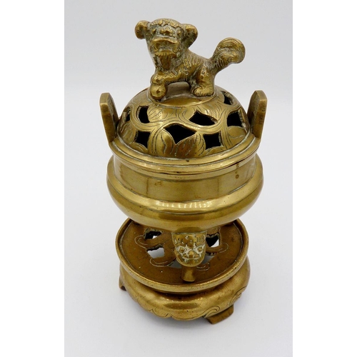 1116A - A small 20th century Chinese brass incense burner on stand with Fo dog finial to lid and masks to le... 