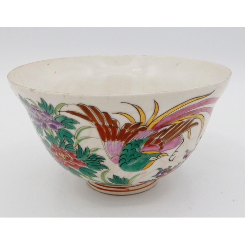 1117 - A Chinese enamel famille rose tea bowl painted exotic birds and flowers, 9.5cm diameter