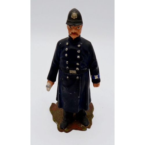 1119 - A painted metal cast model policeman novelty inkwell - the lid jammed, 12cm tall