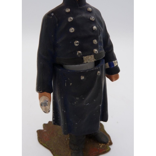 1119 - A painted metal cast model policeman novelty inkwell - the lid jammed, 12cm tall