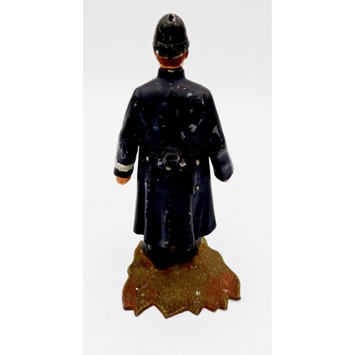 1119 - A painted metal cast model policeman novelty inkwell - the lid jammed, 12cm tall