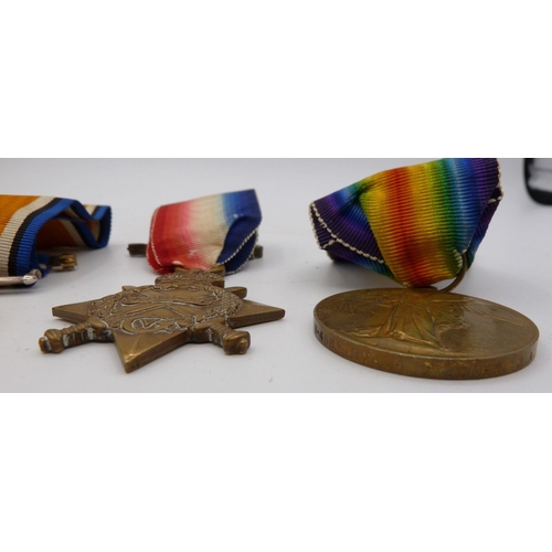 1126 - A set of WWI medals comprising Victory Medal, War Medal and 1914-15 Star to D G Jones W4561 RA & RFA... 