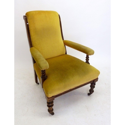 1135 - A Victorian armchair on turned supports