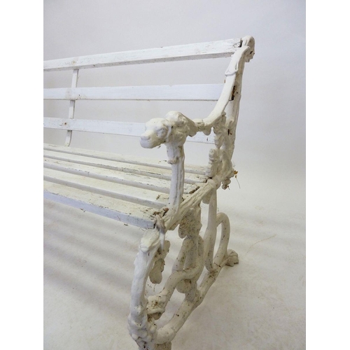 1136 - A Victorian Coalbrookdale style garden bench with dogs head arm rests and scrolling vines, 146cm wid... 