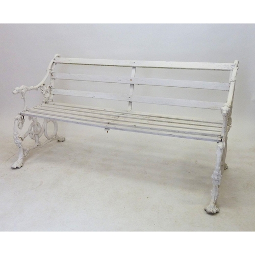 1137 - A Victorian Coalbrookdale style garden bench with dogs head arm rests and scrolling vines, 146cm wid... 